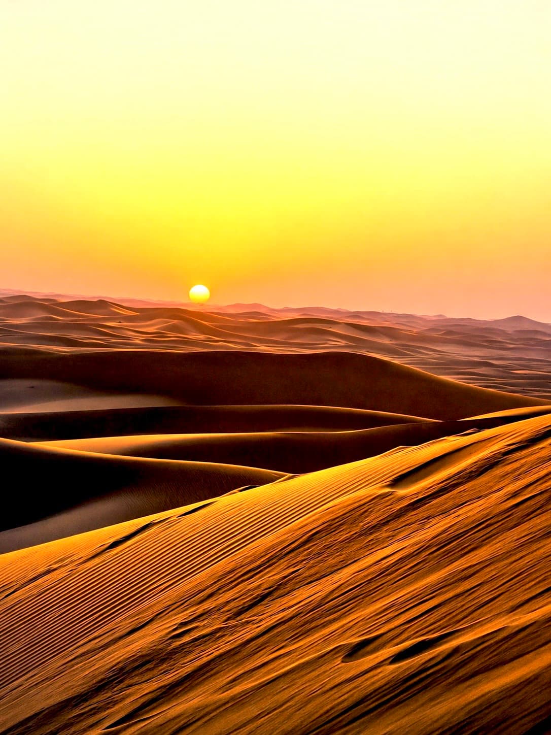 Sunrise light over the Sahara desert dunes in Morocco.